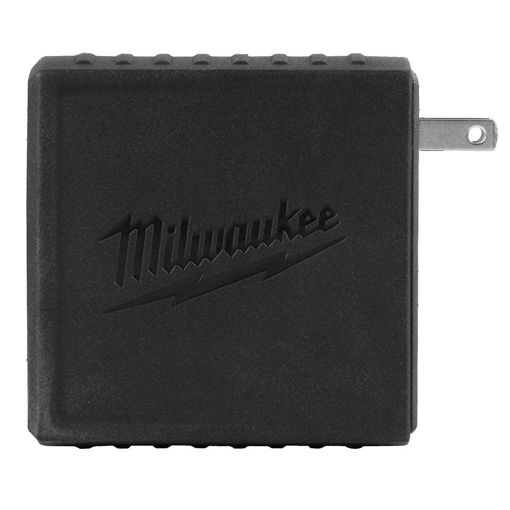 Black Milwaukee power adapter on a white background