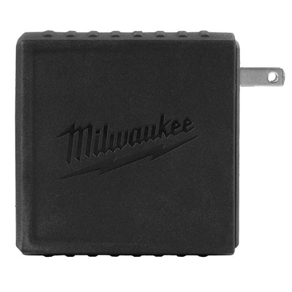 Black Milwaukee power adapter on a white background