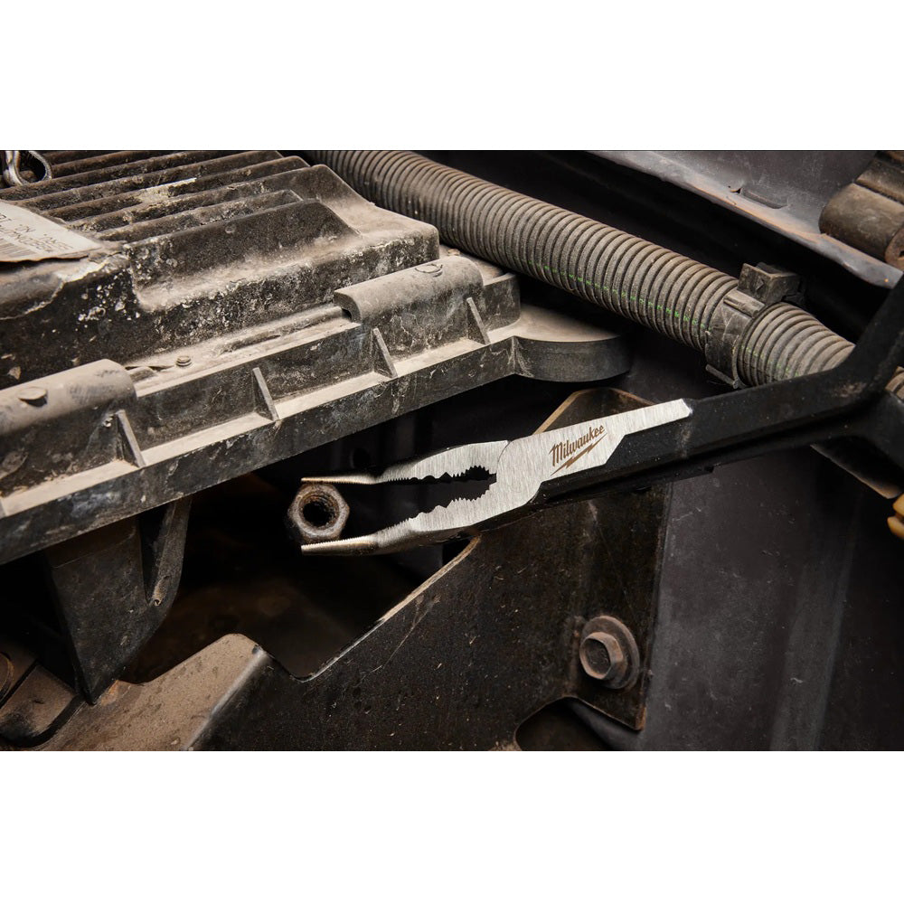 Milwaukee tool being used on a mechanical component with a close-up view.