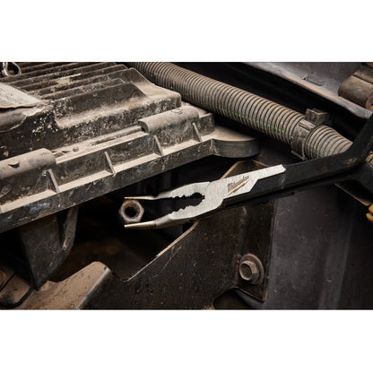 Milwaukee tool being used on a mechanical component with a close-up view.