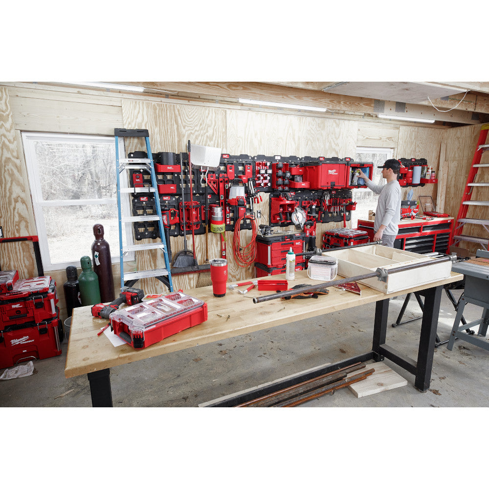 PACKOUT™ boxes and tools mounted on a wall in a shop settings