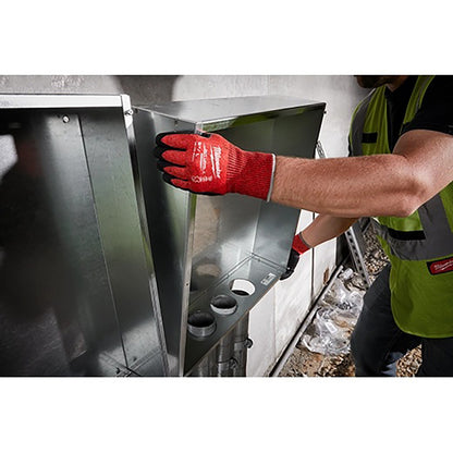 Person wearing a red glove and green safety vest working.