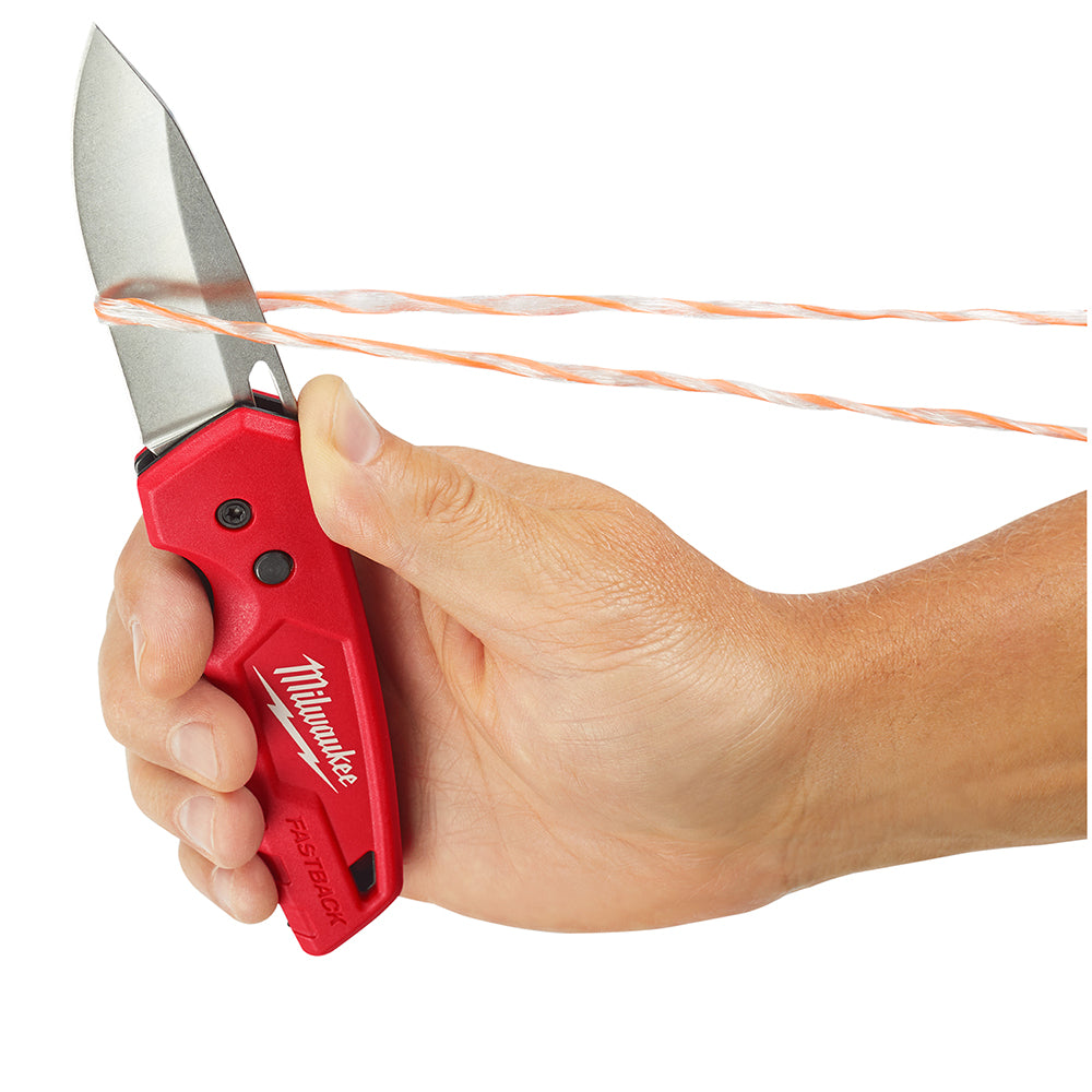Hand holding a FASTBACK™ Folding Pocket Knife with blade out.