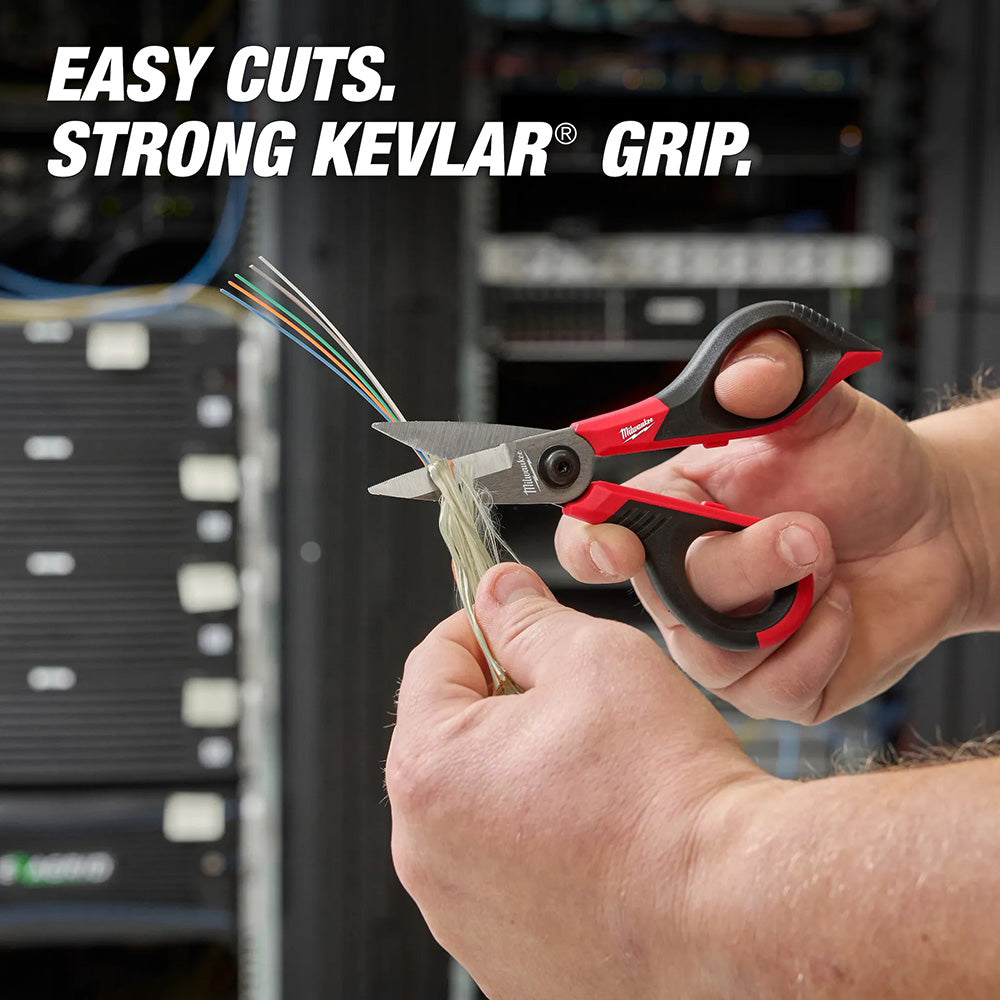 Person using a pair of red and black scissors with Kevlar grip to cut wires, with text 'Easy Cuts. Strong Kevlar Grip.'