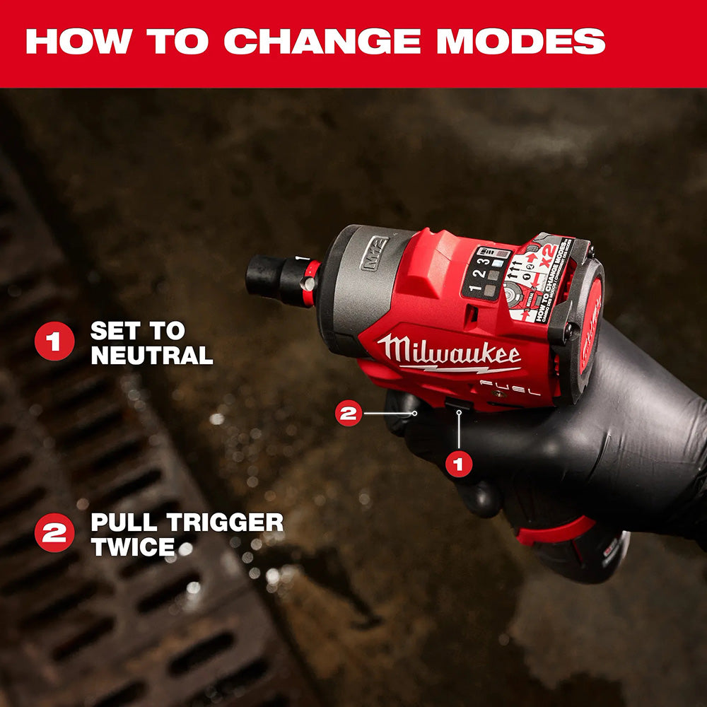 Milwaukee drill with instructions on how to change modes against a dark background