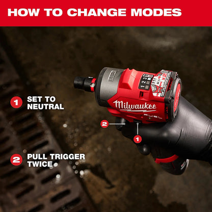 Milwaukee drill with instructions on how to change modes against a dark background