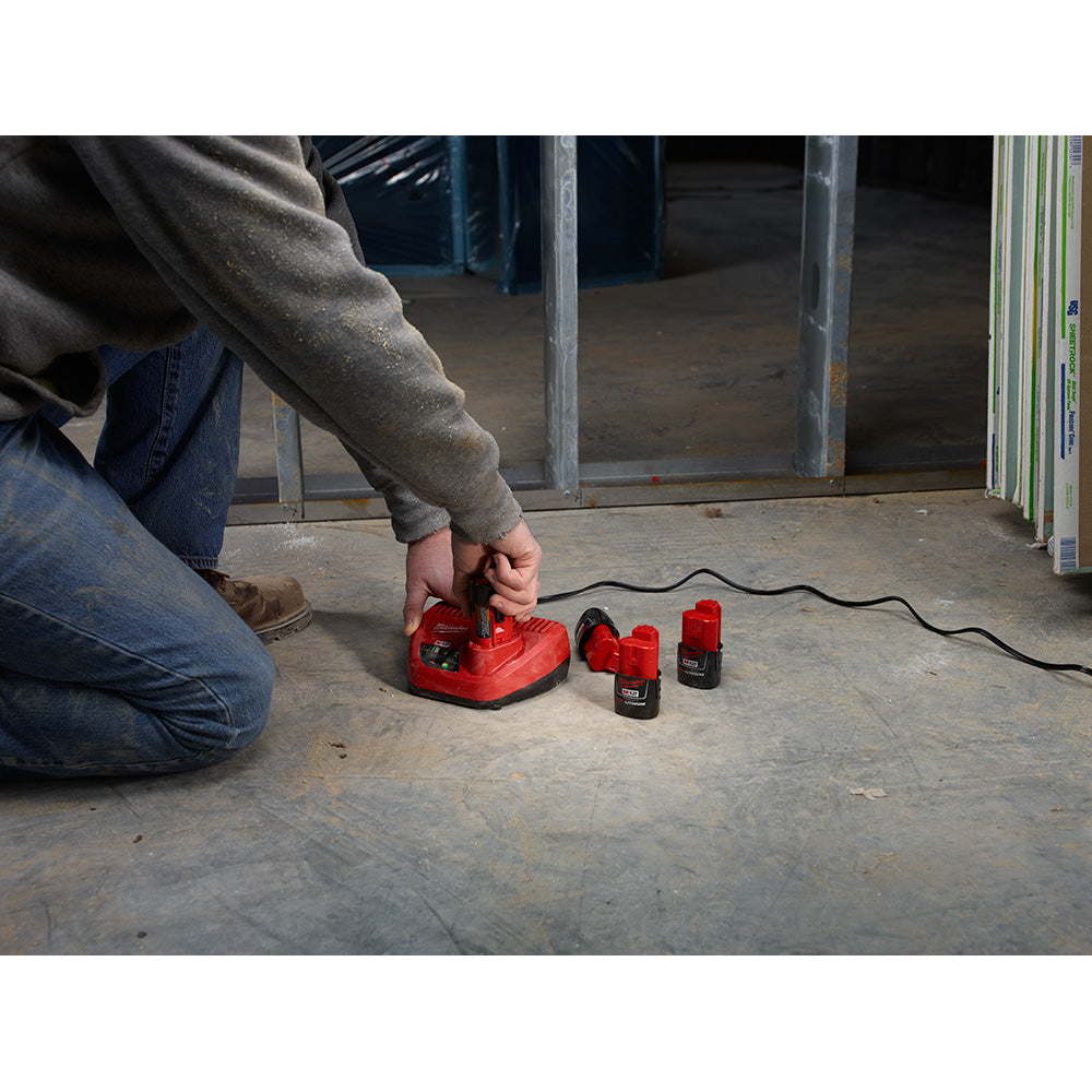 Using the M12™ Lithium-Ion Battery Charger to charge batteries on the jobsite