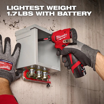 Person using a Milwaukee power tool to open a metal cabinet with text highlighting weight.