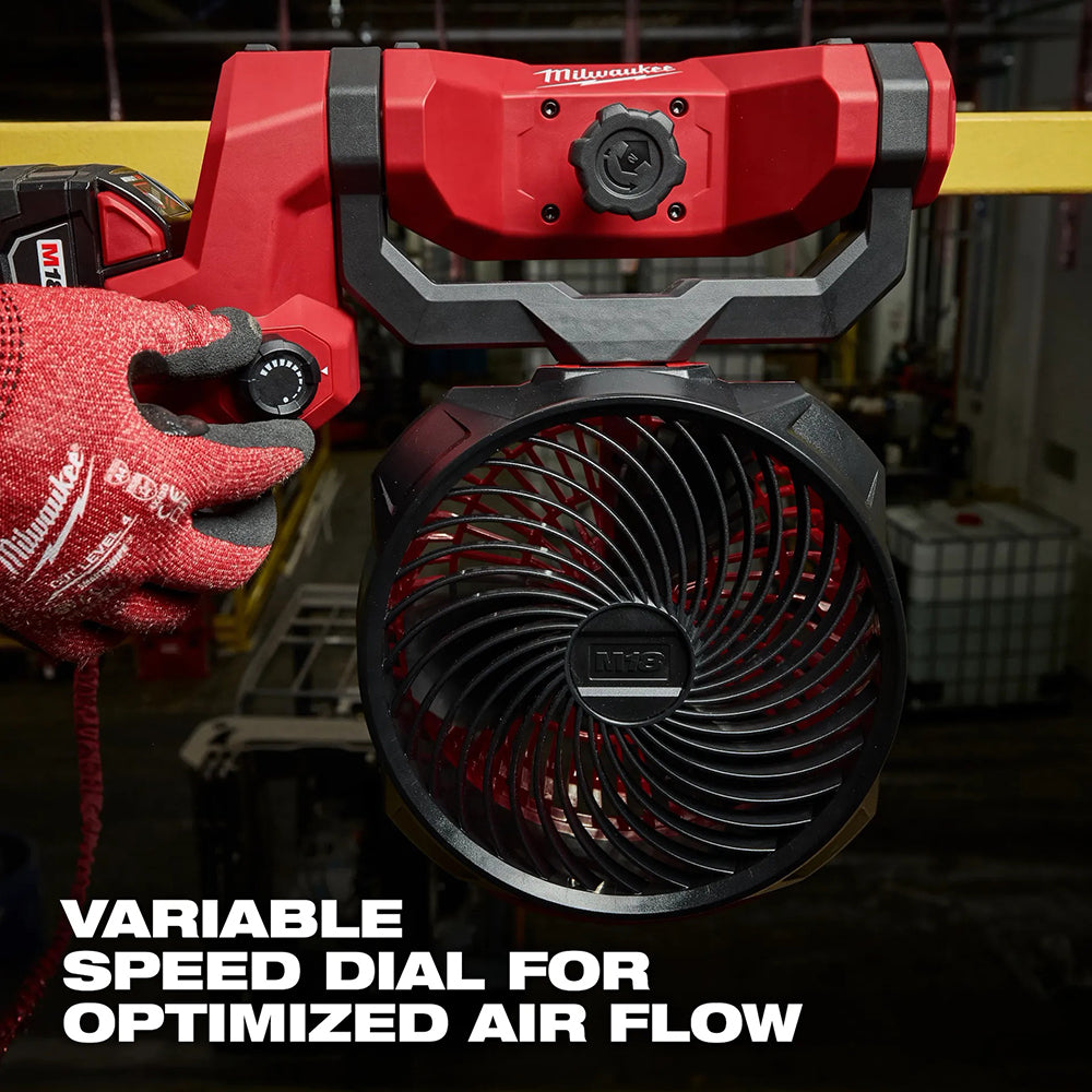 Red and black fan tool with a variable speed dial on a blurred background