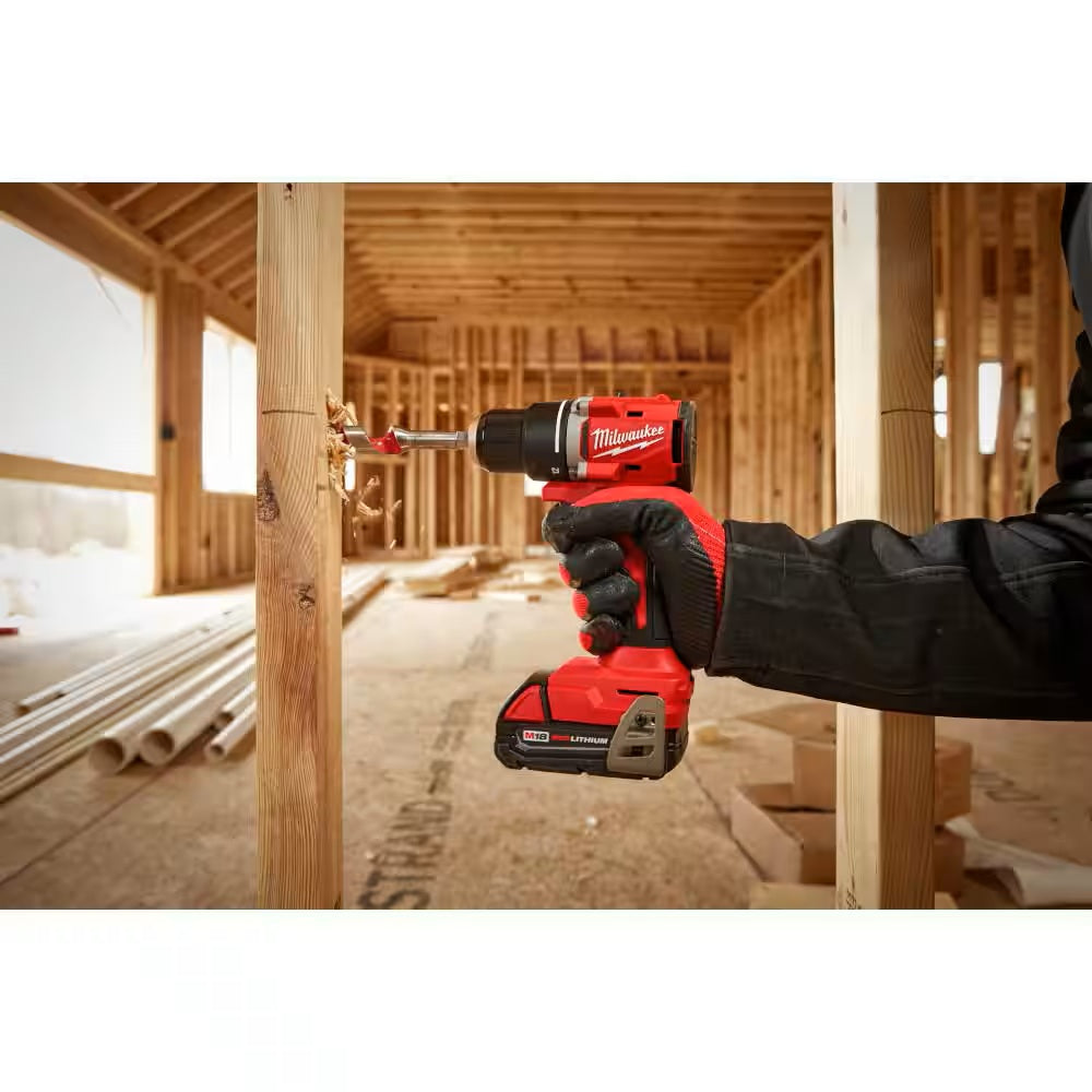 Person using a Milwaukee power drill in a construction setting