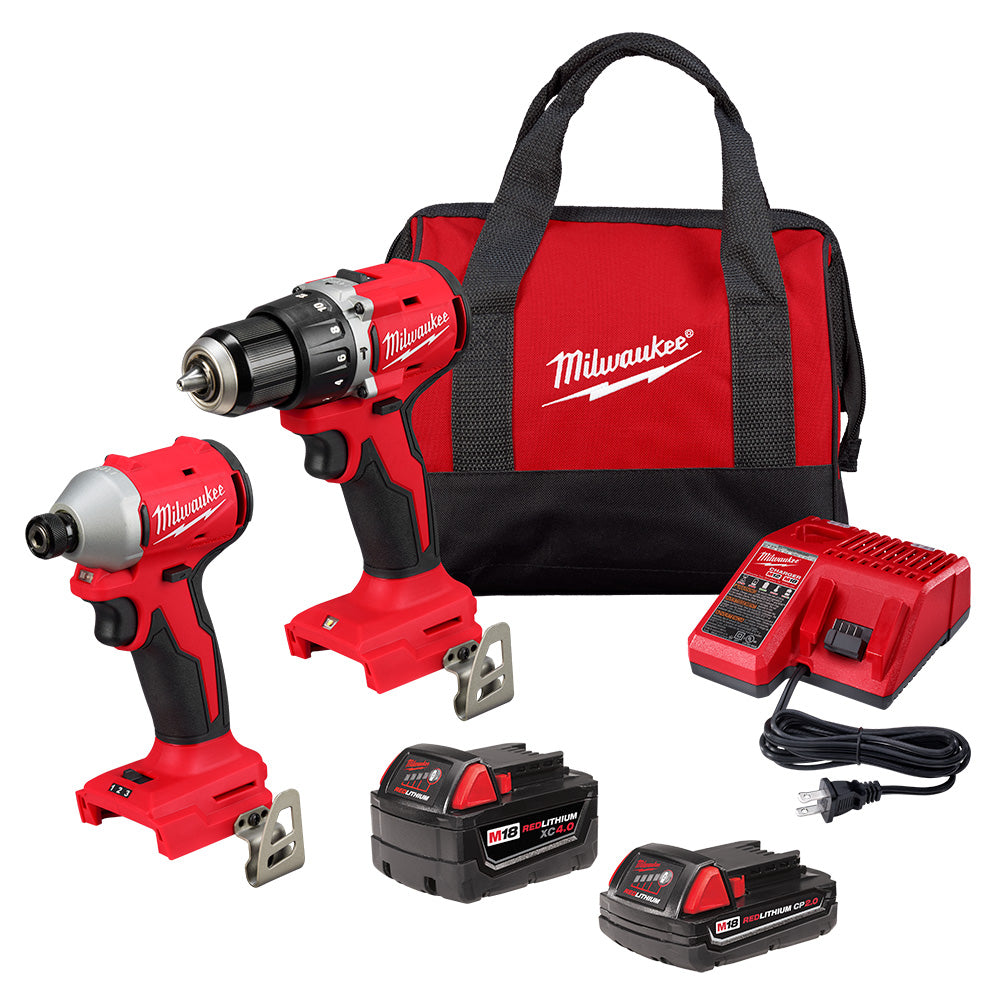 Milwaukee M18 Compact Brushless 2-Tool Combo Kit which includes a hammer drill, impact driver, two batteries, a charger, and a contractor bag, all in red and black color.
