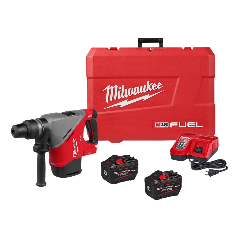 Milwaukee M18 FUEL rotary hammer drill set with case, charger and batteries on a white background