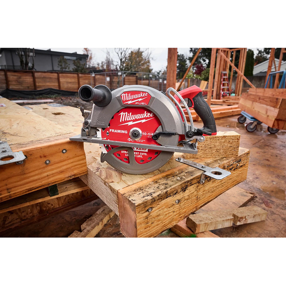 Milwaukee circular saw on a wooden surface with a construction site background