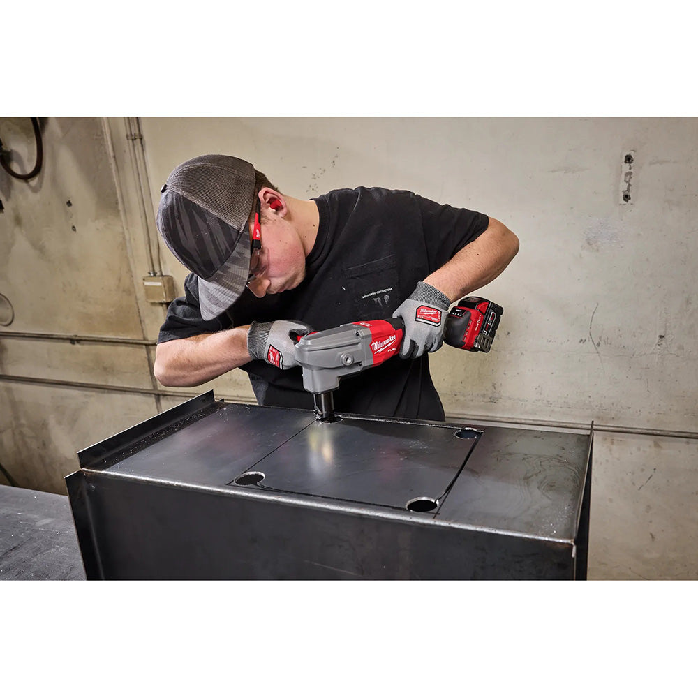 Person using a M18 FUEL™ 10 Gauge Nibbler on a metal surface in a workshop setting