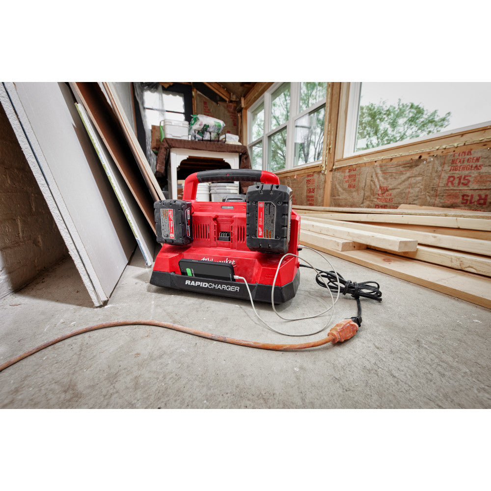 M18™ PACKOUT™ Six Bay Rapid Charger on a wooden floor in a workshop.