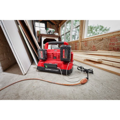 M18™ PACKOUT™ Six Bay Rapid Charger on a wooden floor in a workshop.