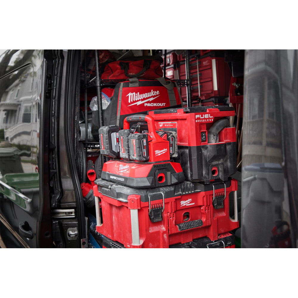 M18™ PACKOUT™ Six Bay Rapid Charger with PACKOUT™ toolboxes and equipment inside a vehicle.