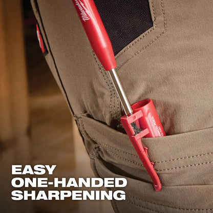 Red Milwaukee mechanic pencil being inserted into a brown pocket with text 'Easy One-Handed Sharpening'.