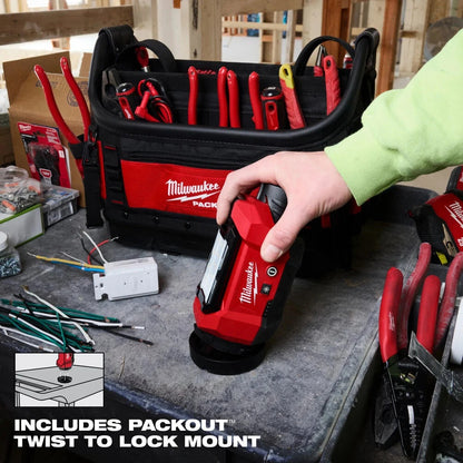 Person using a Milwaukee tool with a tool chest in the background