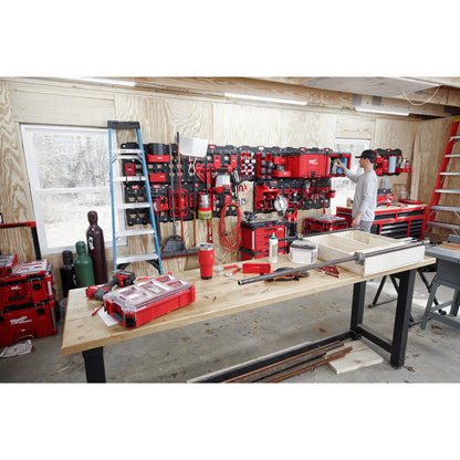 PACKOUT™ Compact Shelf next to other PACKOUT Boxes and Tools in a Workshop Setting
