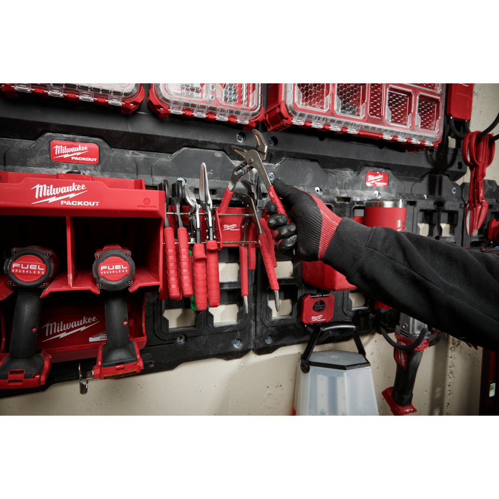 Person organizing tools in a PACKOUT™ Tool Rack.