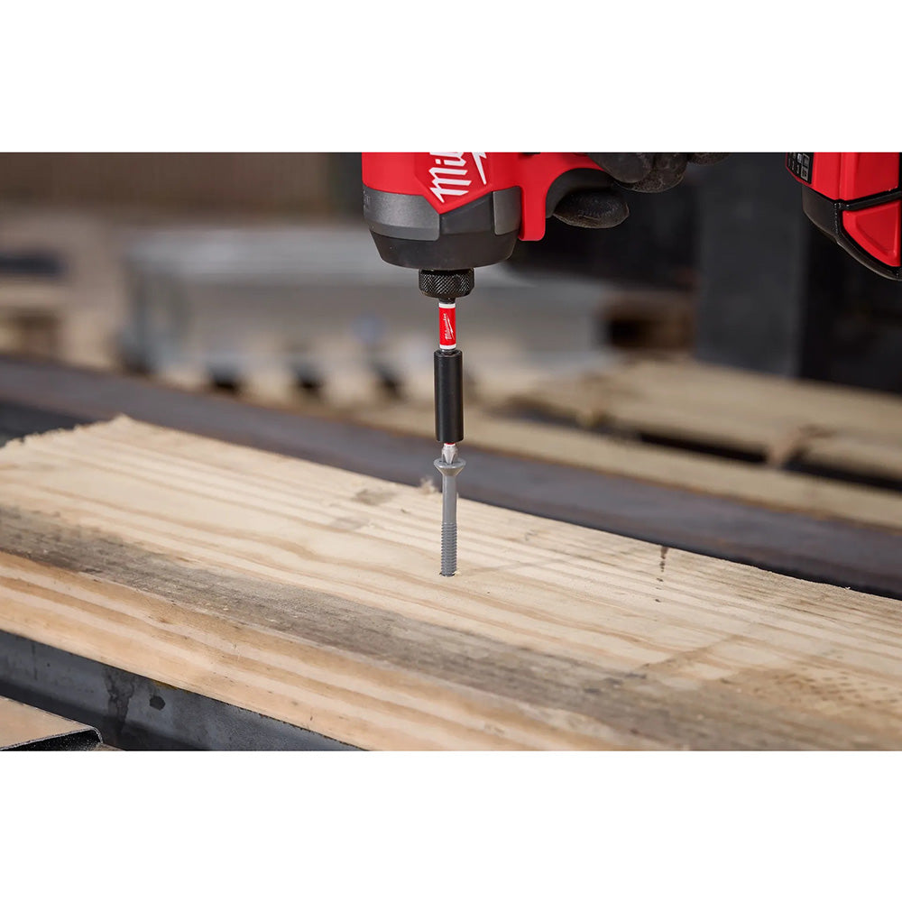 Milwaukee driver bit being used on a wooden surface